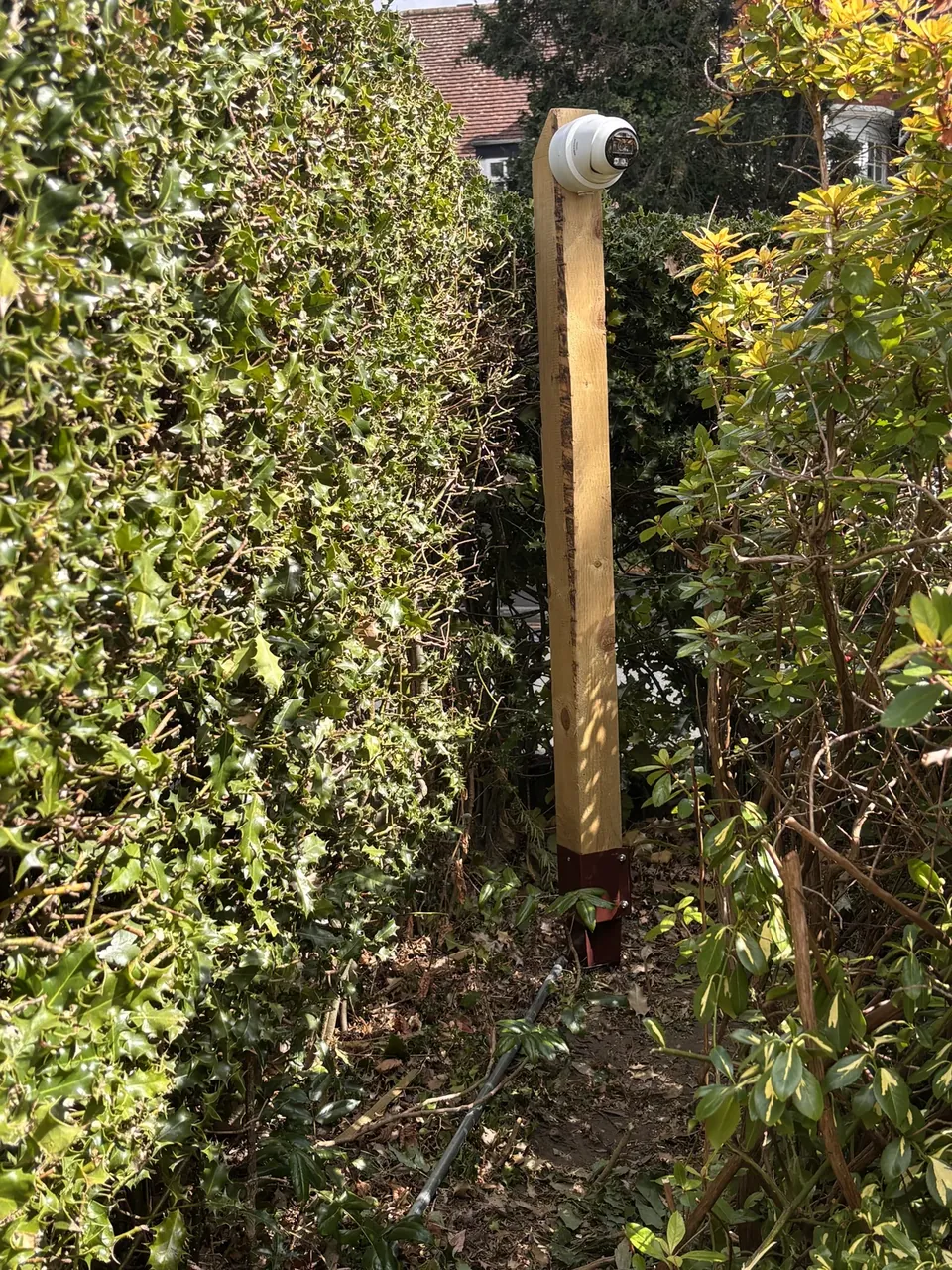 Hik Vision CCTV camera on a post covering a garden in Solihull