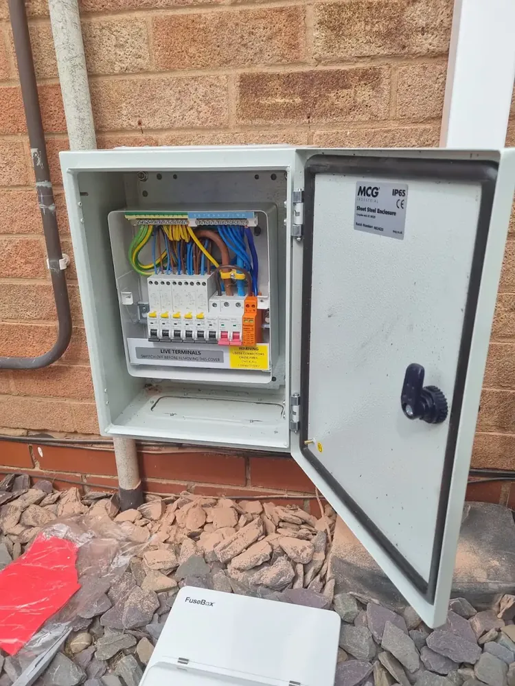 Weatherproof outdoor distribution board wired during a rewire